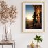 Digital art print of Khoisan woman painting San rock art on a cliff face at sunrise, African tribal wall decor.